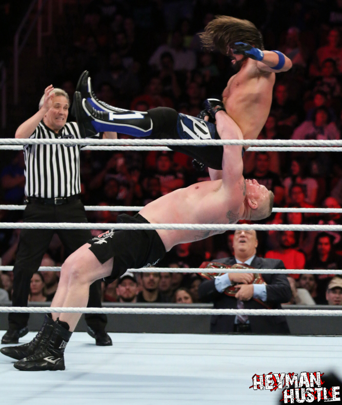 Universal Champion Brock Lesnar vs WWE Champion AJ Styles. 